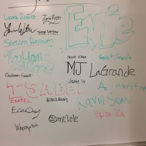Student signatures on the gallery wall. 