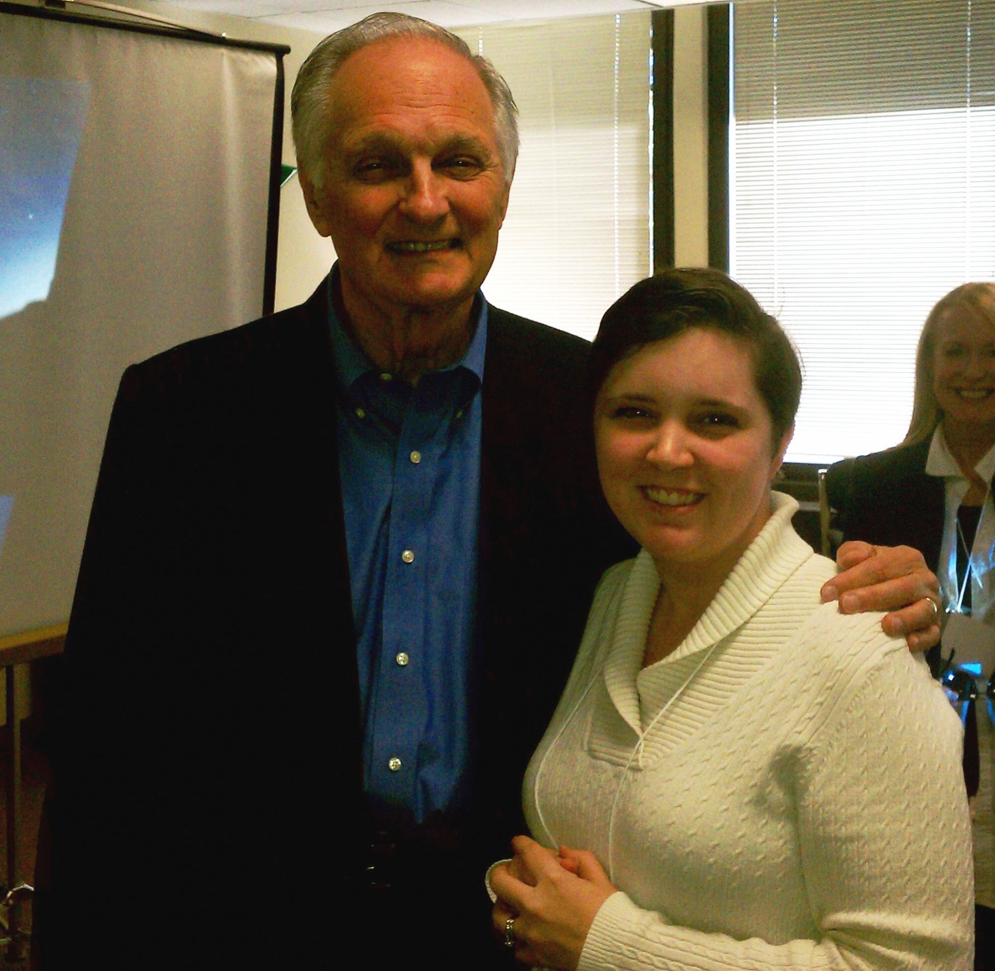 Alan Alda with short, brown haired girl.