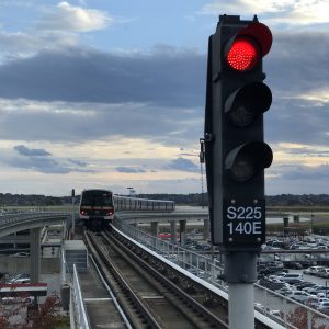 A stoplight on a MARTA train track shows red.